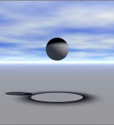 A sphere in broad daylight, with a black anti-light on the top, and a black pool of anti-light below it, with the anti shadow of the sphere showing bright in the middle. It looks like someone dropped black paint on the sphere from above.
